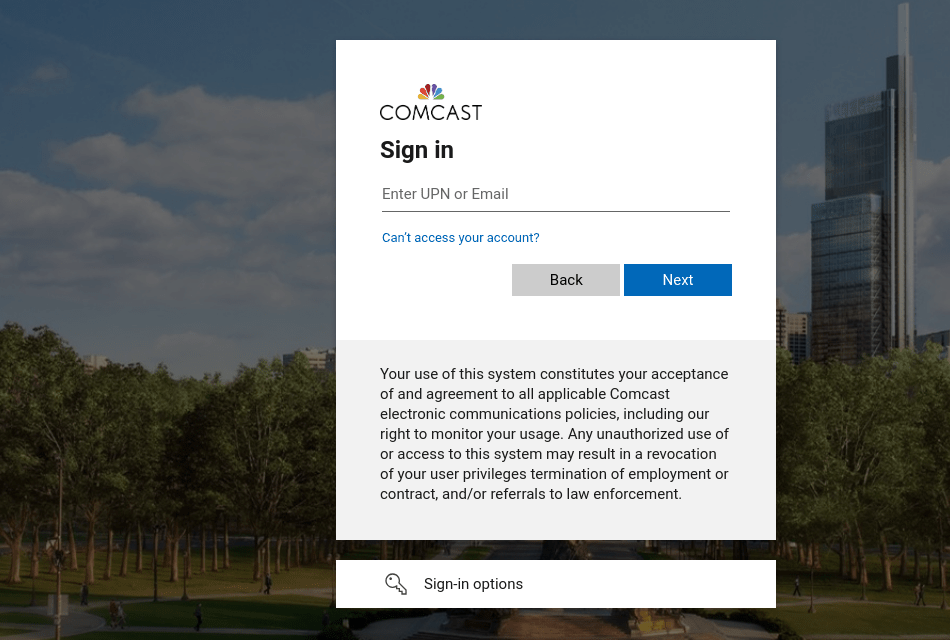 Figure 3. Comcast phishing page targeting employees. Upon credential submission, victims automatically download an AnyDesk executable disguised as a