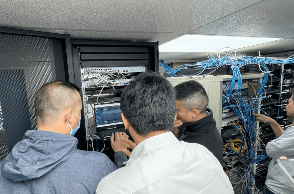 Members of the Hong Kong Police Force raided the premises of the suspects and took more than 1,037 servers linked to malicious services offline. Image credit: INTERPOL and the Hong Kong Police Force