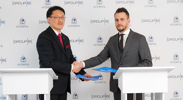 Noboru Nakatani and Ilya Sachkov sign the agreement on cooperation between INTERPOL and Group-IB