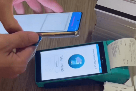 Figure 3d. TX-NFC Reader processing a payment card Figure 3d. TX-NFC Reader processing a payment card
